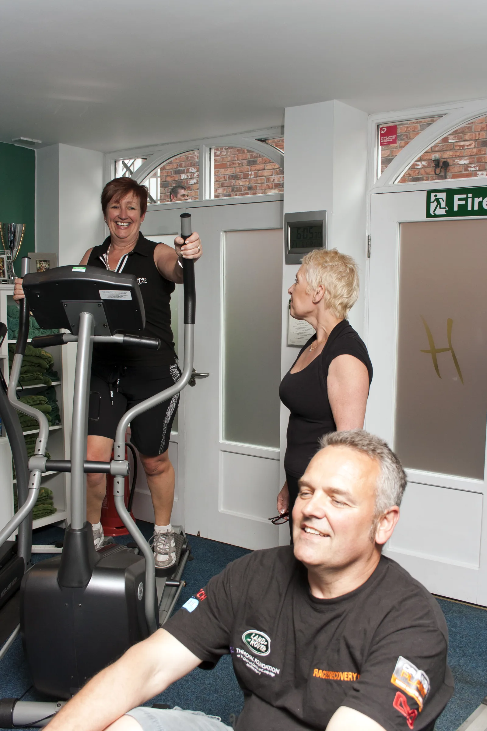 TRX strength training with an older client at Elite Health Knutsford